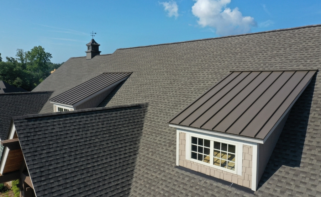 Image of roof with residential roof shingles and metal shingles