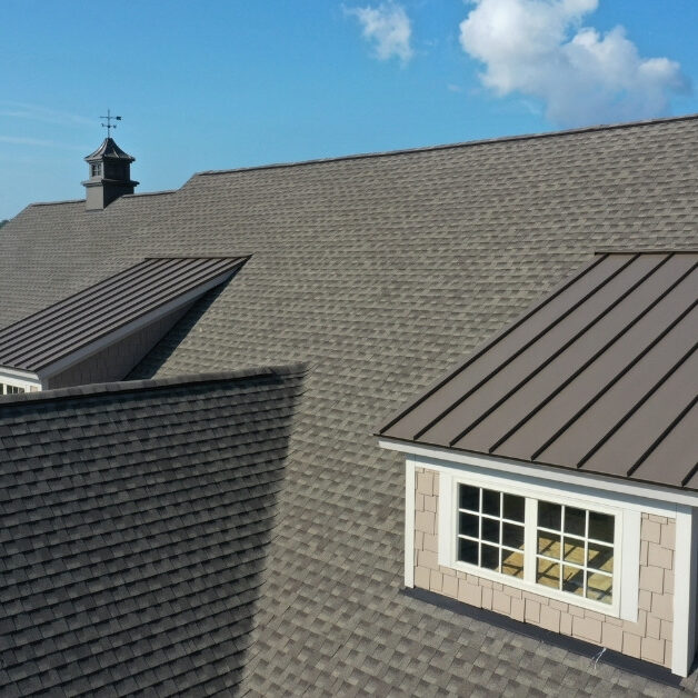 Image of roof with residential roof shingles and metal shingles